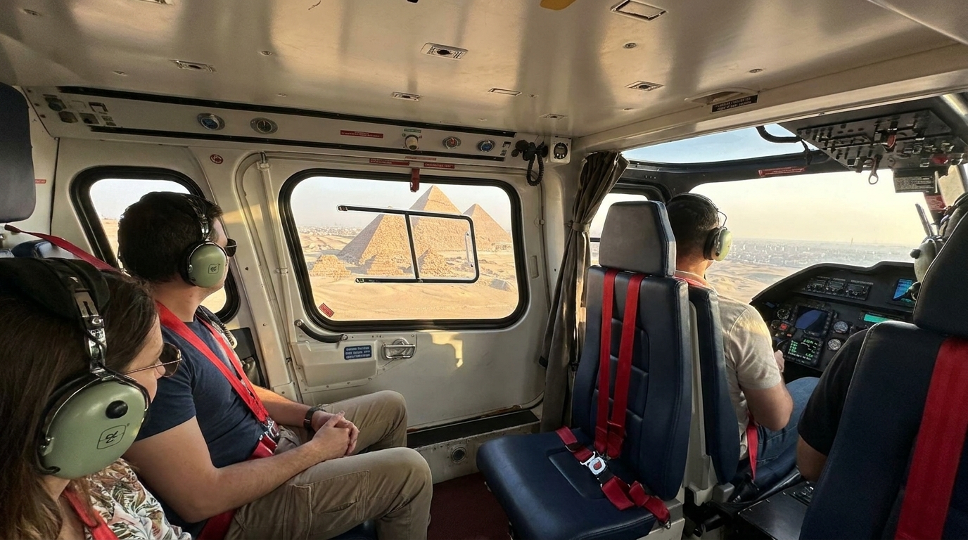 Passengers and a pilot wearing aviation headsets inside the helicopter cabin, looking out at the Giza pyramids