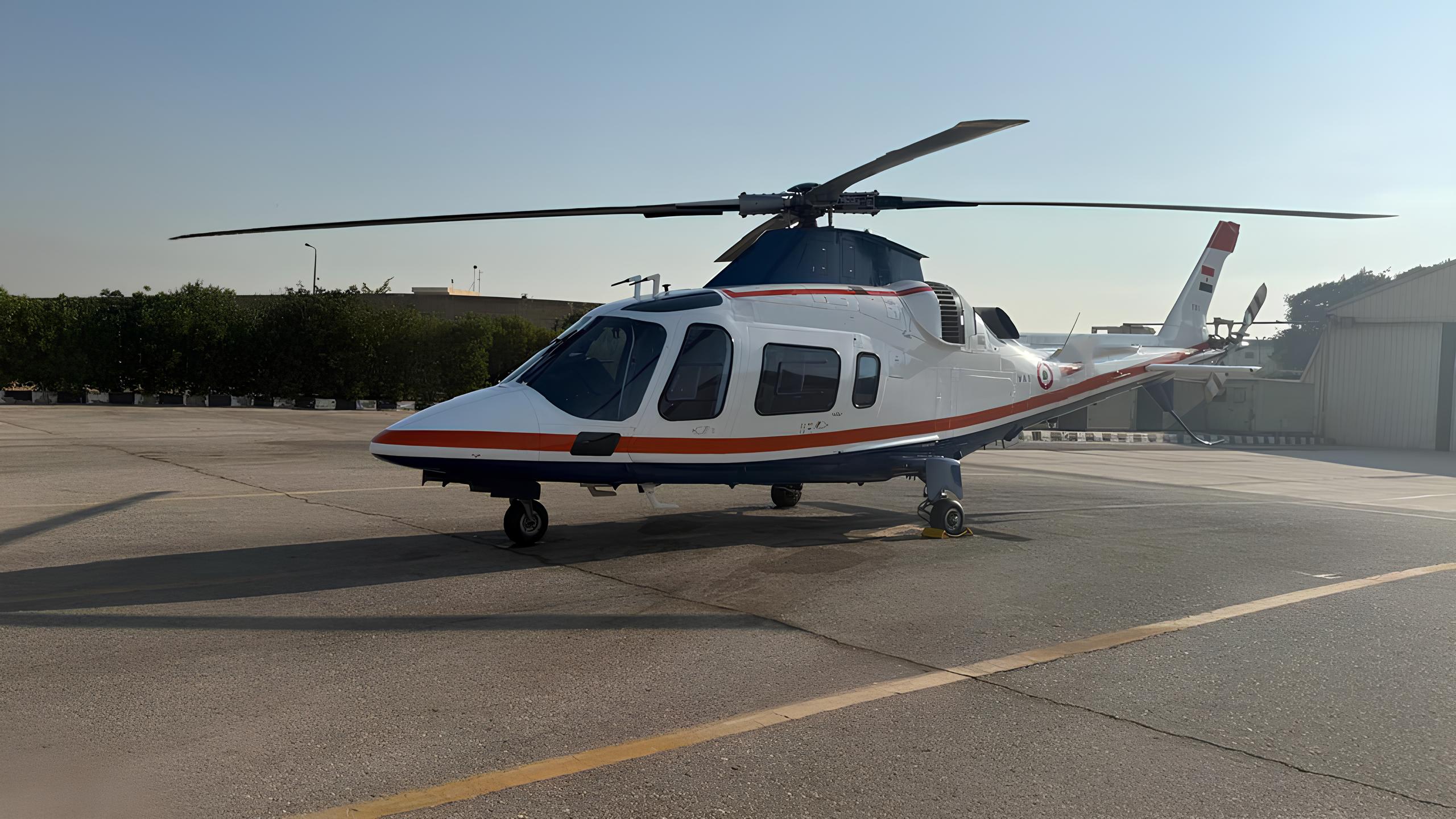 Xtreme Sky helicopter parked on the airfield apron under a clear sky